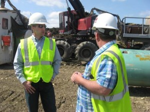 Congressman Markwayne Mullin (OK-2) talks with a worker on the Keystone XL pipeline project near Caddo in southeast Oklahoma. Mullin toured the site on March 28. Mullin voted Wednesday in favor of legislation to expedite the northern leg of the pipeline project.